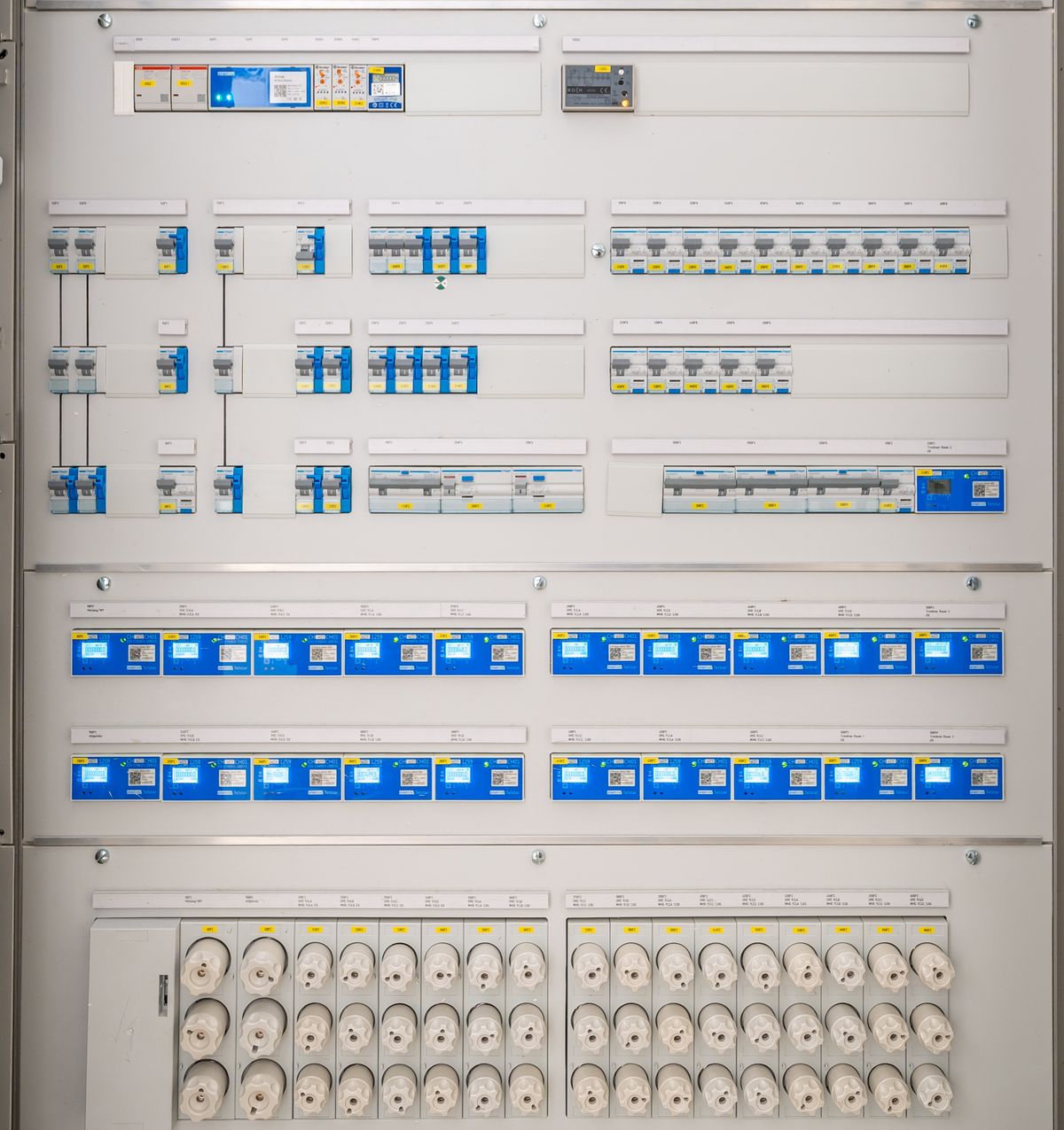 Modern electrical distribution panel with circuit breakers and sockets